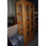 MODERN STAINED BEECH TWO DOOR BOOKCASE WITH TWO FRIEZE DRAWERS