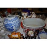 REPRODUCTION IRONSTONE STYLE FOOT BATH, TOGETHER WITH A REPRODUCTION BLUE AND WHITE JAR DECORATED