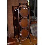 TWO MAHOGANY THREE TIER CAKE STANDS, TOGETHER WITH A MAHOGANY CIRCULAR WINE TABLE