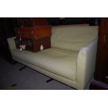 AN AXEL SOFA, UPHOLSTERED IN PALE LIME REMX FABRIC WITH STAINLESS STEEL LEGS