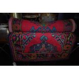 EASTERN PATTERNED RED GROUND RUG WITH GEOMETRIC DESIGN BORDER AND CENTRAL PANEL OF MEDALLIONS