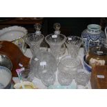 ASSORTED GLASSWARE INCLUDING THREE TRUMPET SHAPED CUT GLASS VASES, PAIR OF DECANTERS AND STOPPERS,