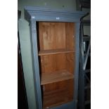 PAINTED PINE OPEN BOOKCASE WITH FIELDED PANEL DOOR AND BASE