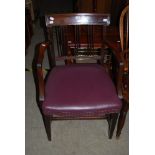 A 19TH CENTURY MAHOGANY CARVER CHAIR WITH SPAR BACK SUPPORTS, STUFFOVER SEAT, REEDED ARMS AND SQUARE