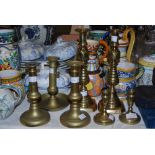 THREE PAIRS OF BRASS CANDLESTICKS, TOGETHER WITH A BRASS CHAMBER CANDLESTICK