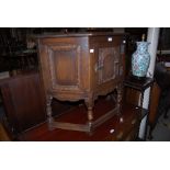 OAK SIDE CABINET WITH SINGLE CUPBOARD DOOR, TOGETHER WITH AN OAK THREE TIER WHATNOT WITH BARLEY