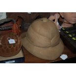 PITH HAT BY J. COMPTON & SONS, SIZE 6 7/8THS, DATED 1917