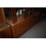 MID 20TH CENTURY G-PLAN E.G. SIDEBOARD WITH FOLDING CUPBOARD DOORS, BANK OF THREE DRAWERS AND FALL