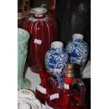 A PAIR OF CHINESE PORCELAIN BLUE AND WHITE JARS DECORATED WITH FIGURES CARRYING LIDDED URNS TOGETHER