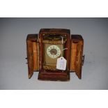 LATE 19TH CENTURY BRASS CARRIAGE CLOCK WITH BLIND FRET WORK DETAIL AND ORIGINAL LEATHER CASE