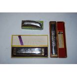 THREE ASSORTED HARMONICAS INCLUDING - THE HOHNER BAND, M. HOHNER ECHO AND UNICHROMATIC TOMBO