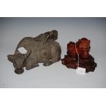 CHINESE AGATE MODEL OF A SHI SHI CUB ON CARVED WOOD STAND, TOGETHER WITH A CHINESE CARVED WOOD