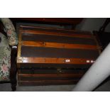CANVAS, WOOD AND BRASS BOUND DOME TOP TREASURE CHEST TRUNK