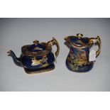 CARLTON WARE POWDER BLUE GROUND CHINOISERIE DECORATED TEA POT AND COVER ON MATCHING STAND,