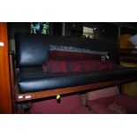 GUY ROGERS - MID 20TH CENTURY MAHOGANY SOFA BED WITH BLACK LEATHERETTE UPHOLSTERED CUSHION SEAT,