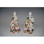 PAIR OF CONTNENTAL MEISSEN STYLE FIGURAL CANDLESTICKS IN THE FORM OF ROMANTIC COUPLES