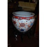 A 20TH CENTURY CHINESE IMARI FISH BOWL ON EBONISED WOODEN STAND