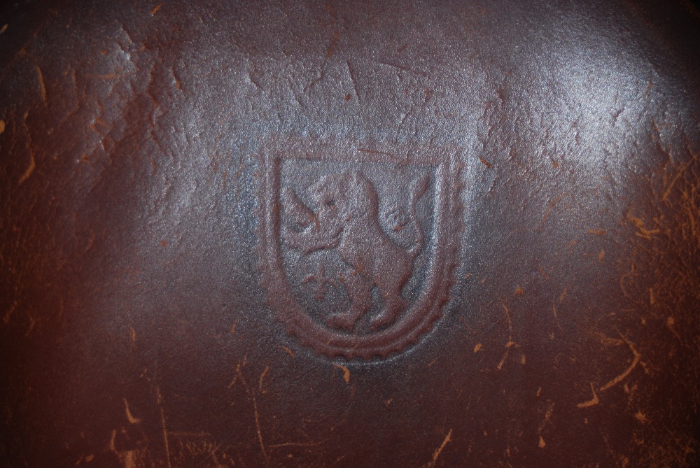 EARLY 20TH CENTURY STAINED BEECH AND LEATHER UPHOLSTERED TUB CHAIR WITH HERALDIC CREST OF LION - Image 2 of 2