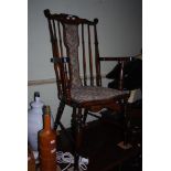 EARLY 20TH CENTURY STAINED BEECH ARMCHAIR WITH UPHOLSTERED CENTRAL SPLAT AND STUFFOVER SEAT