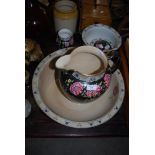 A CETEM WARE BLACK GROUND PEONY DECORATED FIVE PIECE WASH SET