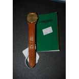 VINTAGE GENTS LONGINES YELLOW METAL WRIST WATCH WITH CHAMPAGNE COLOURED DIAL, BATON NUMERALS,