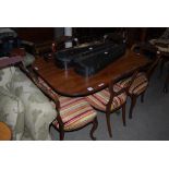 A 19TH CENTURY MAHOGANY SNAP TOP PEDESTAL TABLE ON THREE DOWN SWEPT SUPPORTS WITH BRASS PAW FEET AND