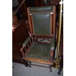 EARLY 20TH CENTURY STAINED BEECH AND GREEN LEATHERETTE UPHOLSTERED ROCKING CHAIR