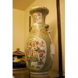 CHINESE PORCELAIN APPLE GREEN GROUND FAMILLE ROSE TWIN HANDLED VASE, QING DYNASTY, DECORATED WITH