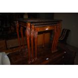 REPRODUCTION NEST OF THREE MAHOGANY OCCASIONAL TABLES ON CLAW AND BALL FEET