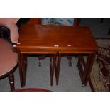 MID 20TH CENTURY TRI-FORM FURNITURE TEAK TROLLEY CONCEALING TWO OCCASIONAL TABLES BELOW