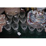 SET OF SIX CUT GLASS STEMMED WINE GLASSES, TOGETHER WITH A SET OF FIVE FACET CUT STEMMED WINE