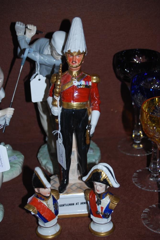 PORCELAIN FIGURE OF AN OFFICER, TITLED 'GENTLEMAN AT ARMS', TOGETHER WITH TWO CERAMIC GERMAN BUST