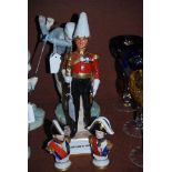 PORCELAIN FIGURE OF AN OFFICER, TITLED 'GENTLEMAN AT ARMS', TOGETHER WITH TWO CERAMIC GERMAN BUST