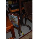 STAINED BEECH BENTWOOD COAT STAND AND AN OAK FRAMED NEEDLEWORK UPHOLSTERED FIRE SCREEN