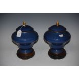 PAIR OF ROYAL WORCESTER POWDER BLUE GROUND JARS AND COVERS, WITH GILDED DETAILS AND PUCE MARKS,