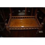 VICTORIAN OAK RECTANGULAR WHATNOT SECTION ON SHORT SUPPORTS WITH BROWN CERAMIC CASTORS