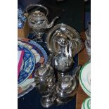 COLLECTION OF ASSORTED EP WARES INCLUDING SPIRITS KETTLE ON STAND, PLATED CLARET JUG, FOUR PIECE