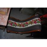 A 19TH CENTURY NEEDLEWORK UPHOLSTERED MAHOGANY NURSING CHAIR