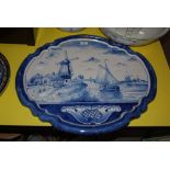 LARGE OVAL SHAPED DELFT HANGING PLAQUE DECORATED WITH RIVER SCENE WITH WINDMILLS AND BOAT