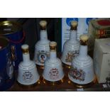 FIVE ASSORTED BELLS ROYAL COMMEMORATIVE DECANTERS