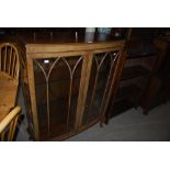 EARLY 20TH CENTURY MAHOGANY BOW FRONT DISPLAY CABINET, TOGETHER WITH A STAINED BEECH OPEN BOOKCASE