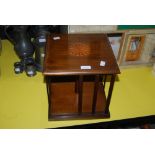 MAHOGANY SQUARE REVOLVING BOOK STAND WITH CIRCULAR INLAID DETAIL