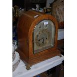 A 20TH CENTURY OAK CASED MANTEL CLOCK WITH SILVERED DIAL AND TWO SUBSIDIARY DIALS