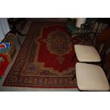 MACHINE MADE MADDER GROUND PERSIAN STYLE CARPET WITH LARGE CENTRAL FLORAL MEDALLION