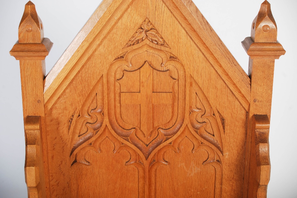 An early 20th century oak Gothic altar chair, the triangular panelled back centred with a relief - Image 4 of 9