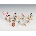 A late 19th/early 20th century Dresden porcelain nine piece monkey band, comprising: conductor and