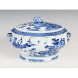 A Chinese porcelain blue and white oval shaped twin handled tureen and cover, Qing Dynasty, the