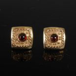 A pair of 9 carat yellow gold and garnet cabochon square earrings, Stamped: 375.