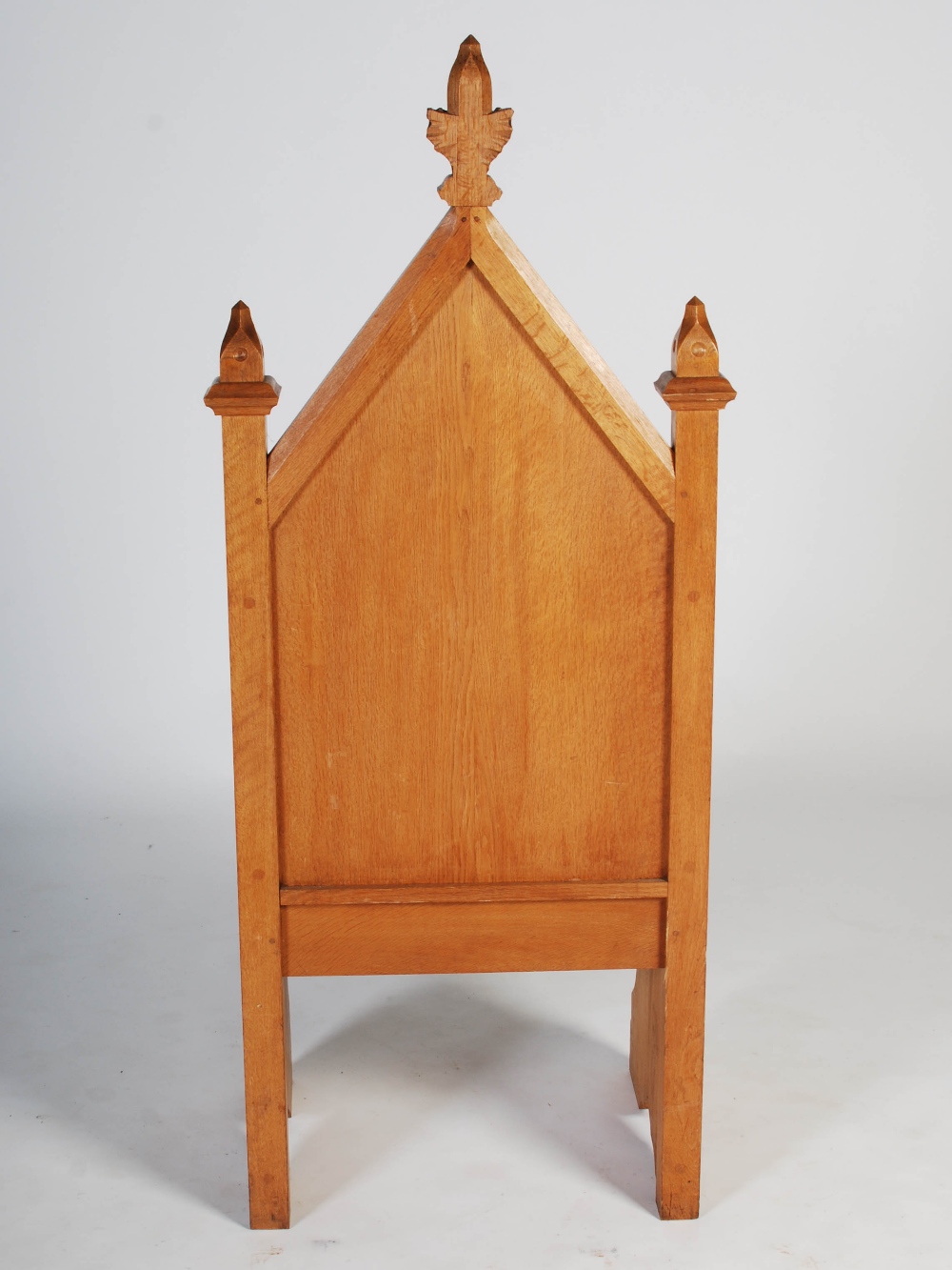 An early 20th century oak Gothic altar chair, the triangular panelled back centred with a relief - Image 8 of 9