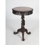 A Chinese dark wood occasional table, Qing Dynasty, the circular top with a red and white marble